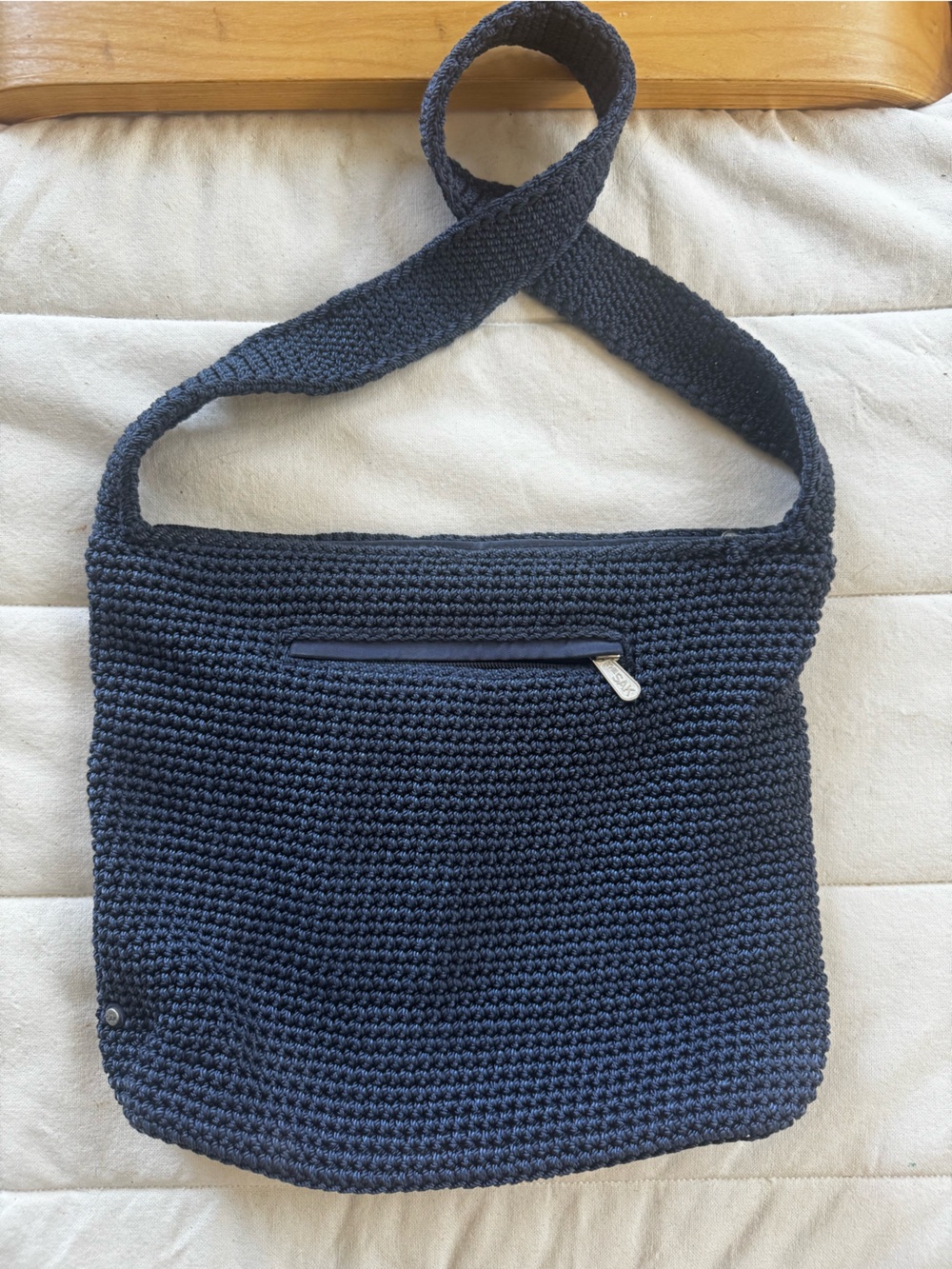 The Sak Crochet Crossbody Bag 
with Striped Interior